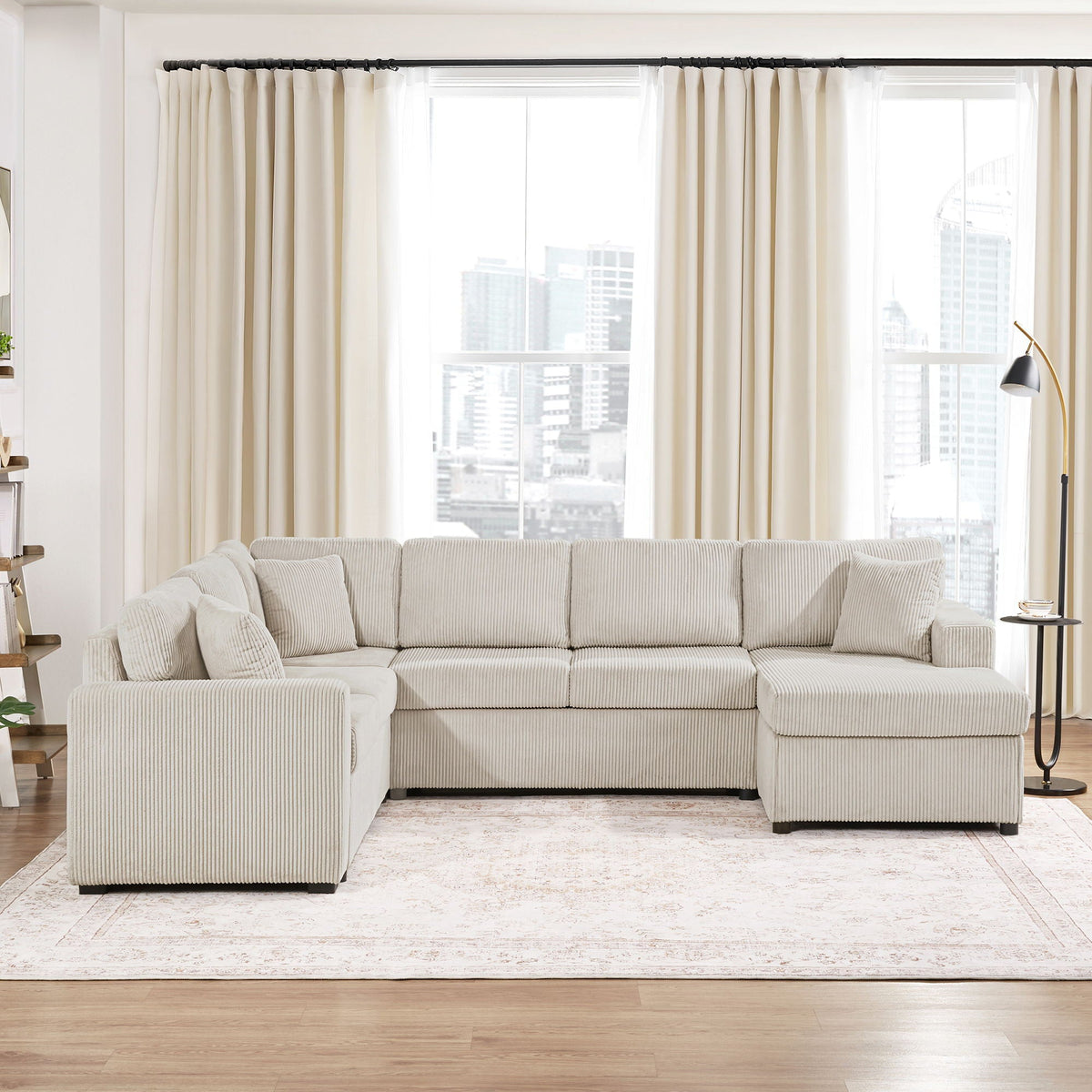 Oversized U-shaped sectional sofa with chaise and three soft pillows in beige ribbed fabric on Tampa Home & Garden Store