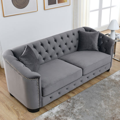 Modern Chesterfield sofa with tufted backrest in gray upholstery, studded arms stationary on Tampa Home & Garden Store