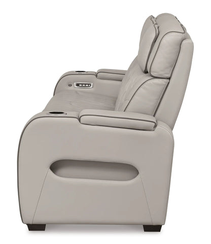 Boyington power reclining sofa with adjustable headrests in beige leather; built-in cup holders on Tampa Home & Garden Store
