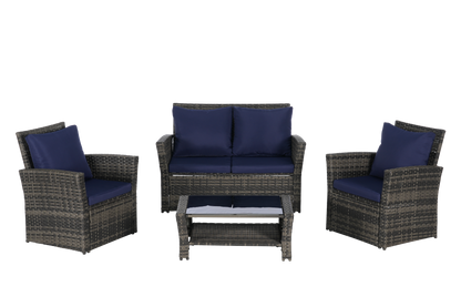 4-piece outdoor rattan set with navy cushions: two chairs, loveseat, glass coffee table on Tampa Home & Garden Store