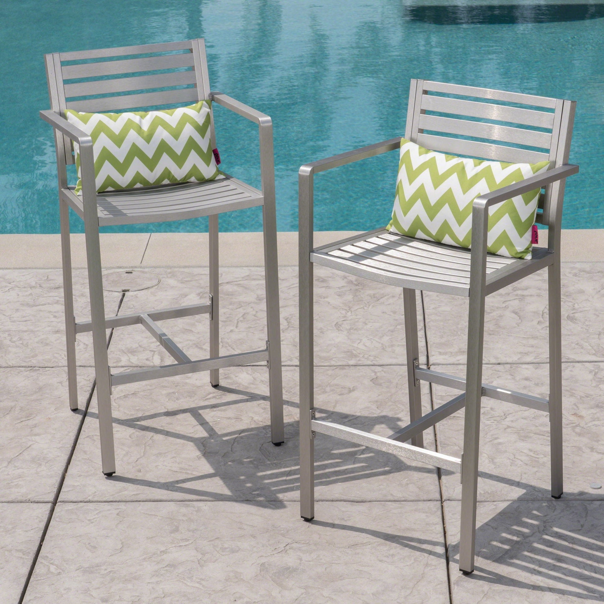 Outdoor aluminum rust-proof barstools set of 2 in silver with green chevron cushions by pool on Tampa Home & Garden Store