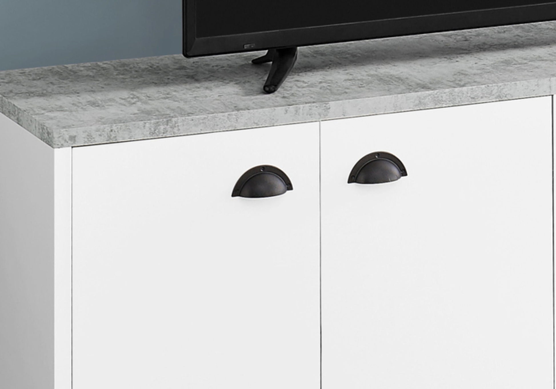 Contemporary TV stand console with white doors, gray marble-top, and black arch pulls on Tampa Home & Garden Store