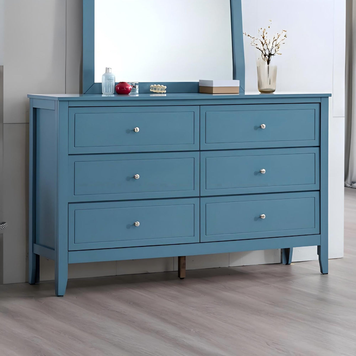 Spacious blue 6-drawer dresser with metal knobs and attached mirror on Tampa Home & Garden Store