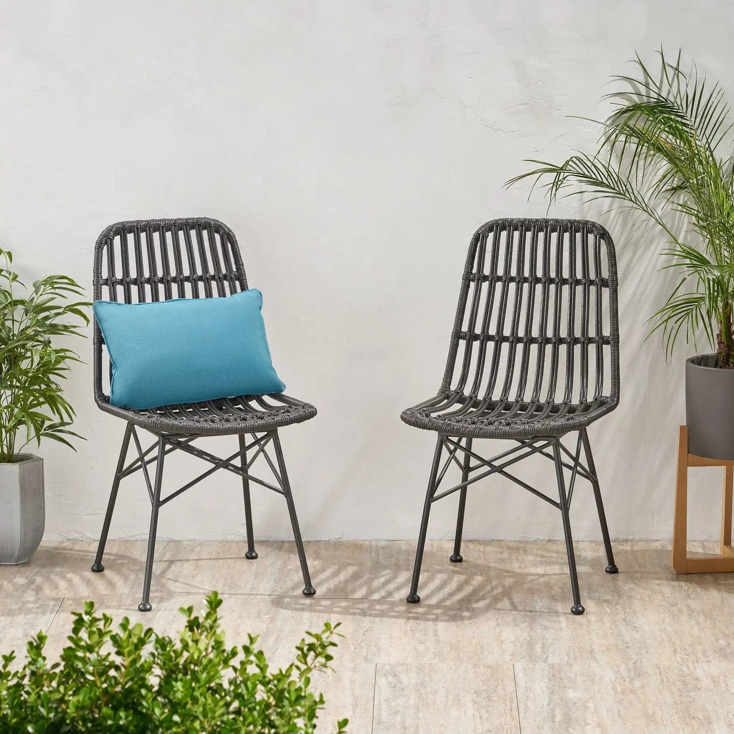 Sawtelle Outdoor Dining Chairs set of 2 in black wicker with blue cushions on Tampa Home & Garden Store