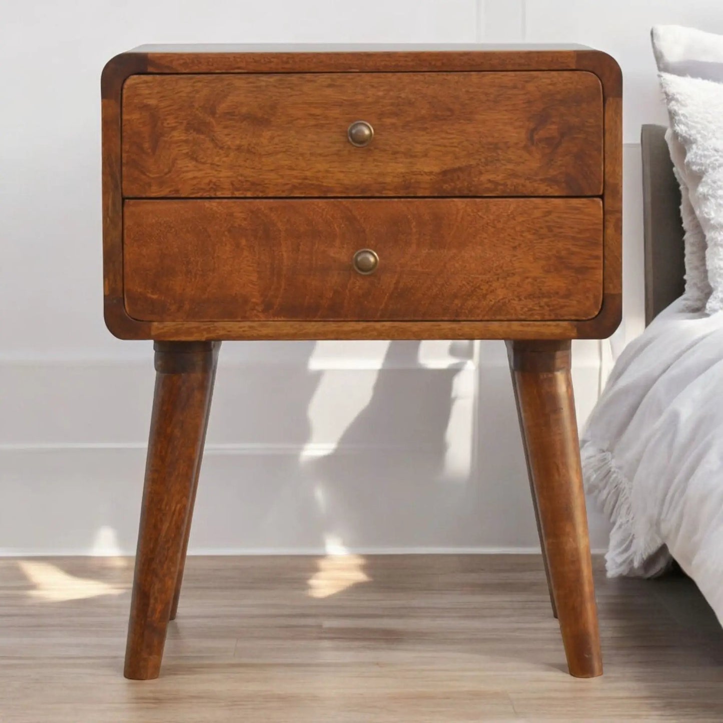 Curved nightstand with rounded edges in warm wood finish, metal knob on Tampa Home & Garden Store