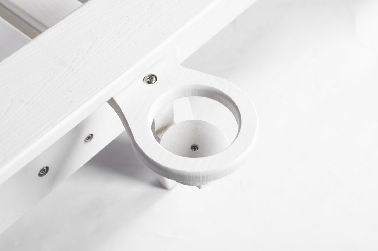 Outdoor lounge chair with white wood-textured finish and circular ring armrest on Tampa Home & Garden Store