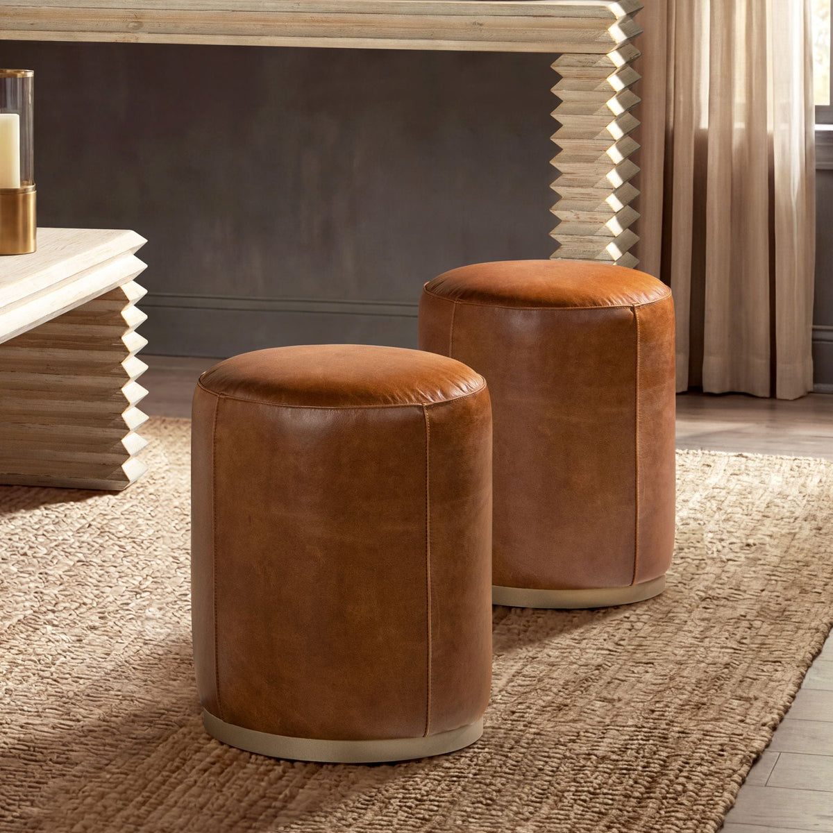 Brown leather round ottomans, stitched seams, chic space on Tampa Home & Garden Store