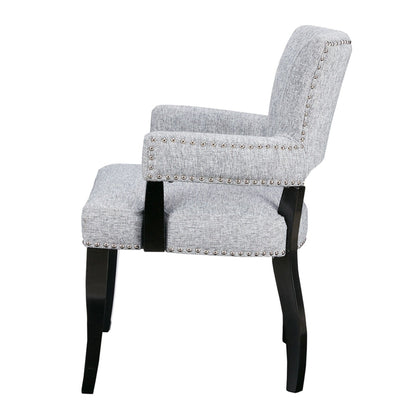 Elegant Arm Dining Chair in gray upholstery with brass nail head detailing by HouseOfZazla on Tampa Home & Garden Store