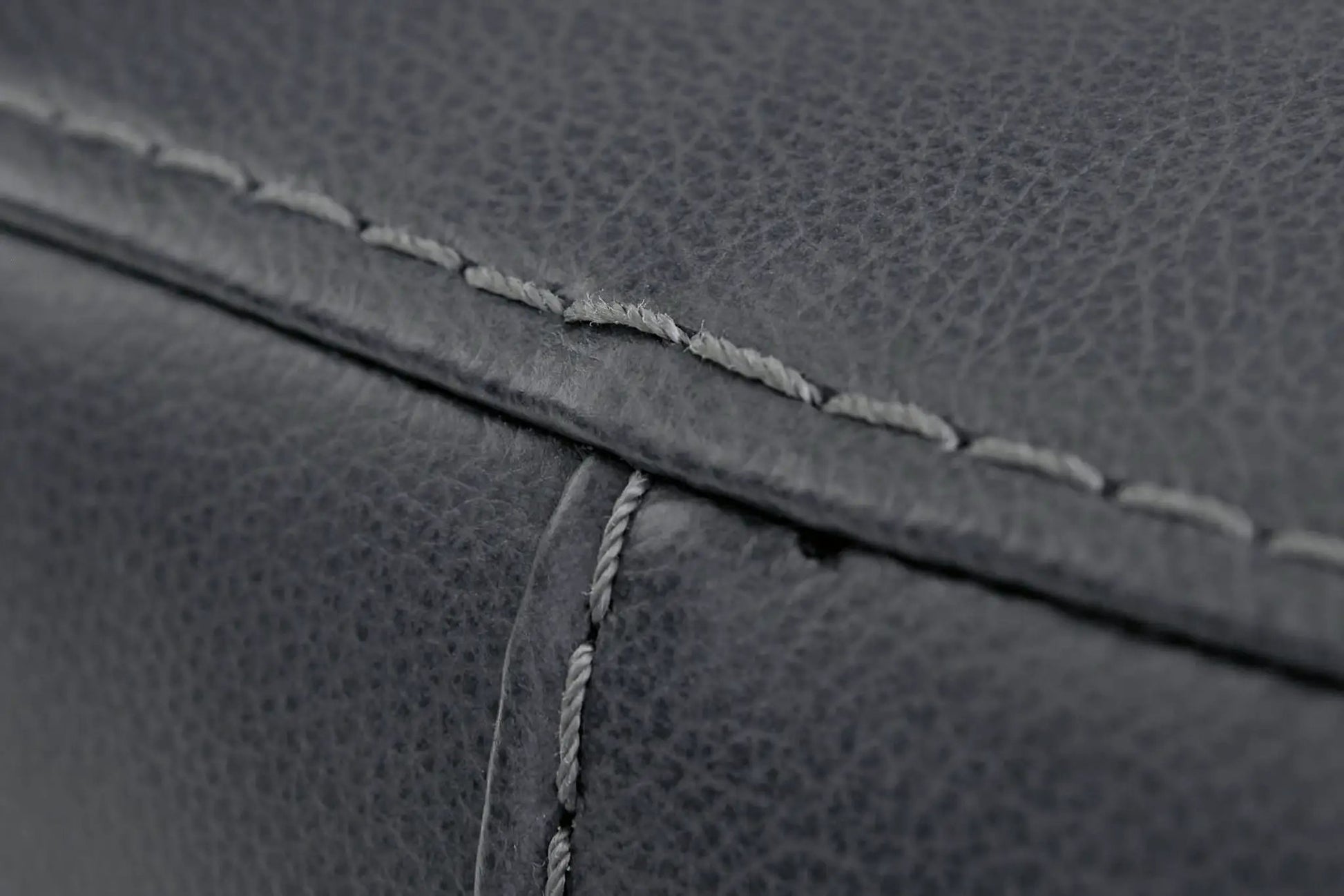 Bolsena Rocker Recliner upholstery close-up in dark gray textured fabric with exposed stitching on Tampa Home & Garden Store