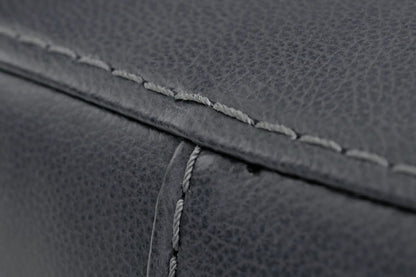 Bolsena Rocker Recliner upholstery close-up in dark gray textured fabric with exposed stitching on Tampa Home & Garden Store