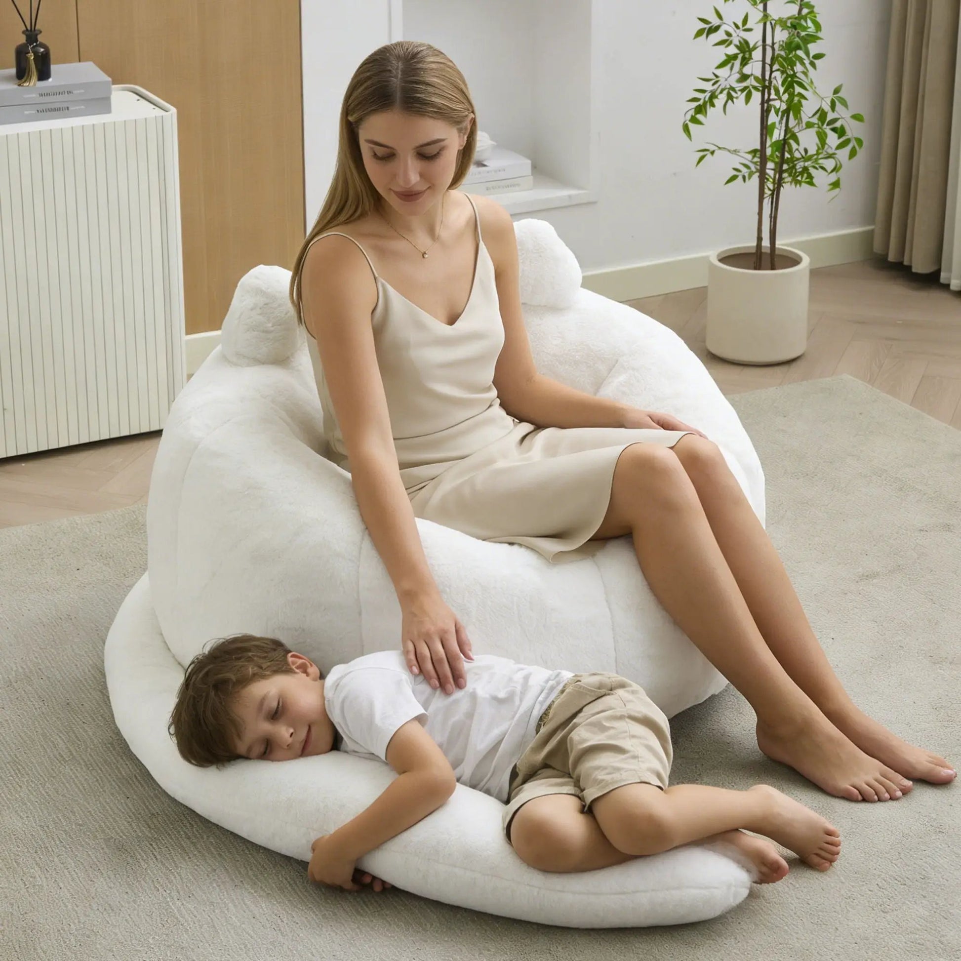 Cat shaped bean bag sofa in white plush fabric with long tail; kids lounge on it on Tampa Home & Garden Store