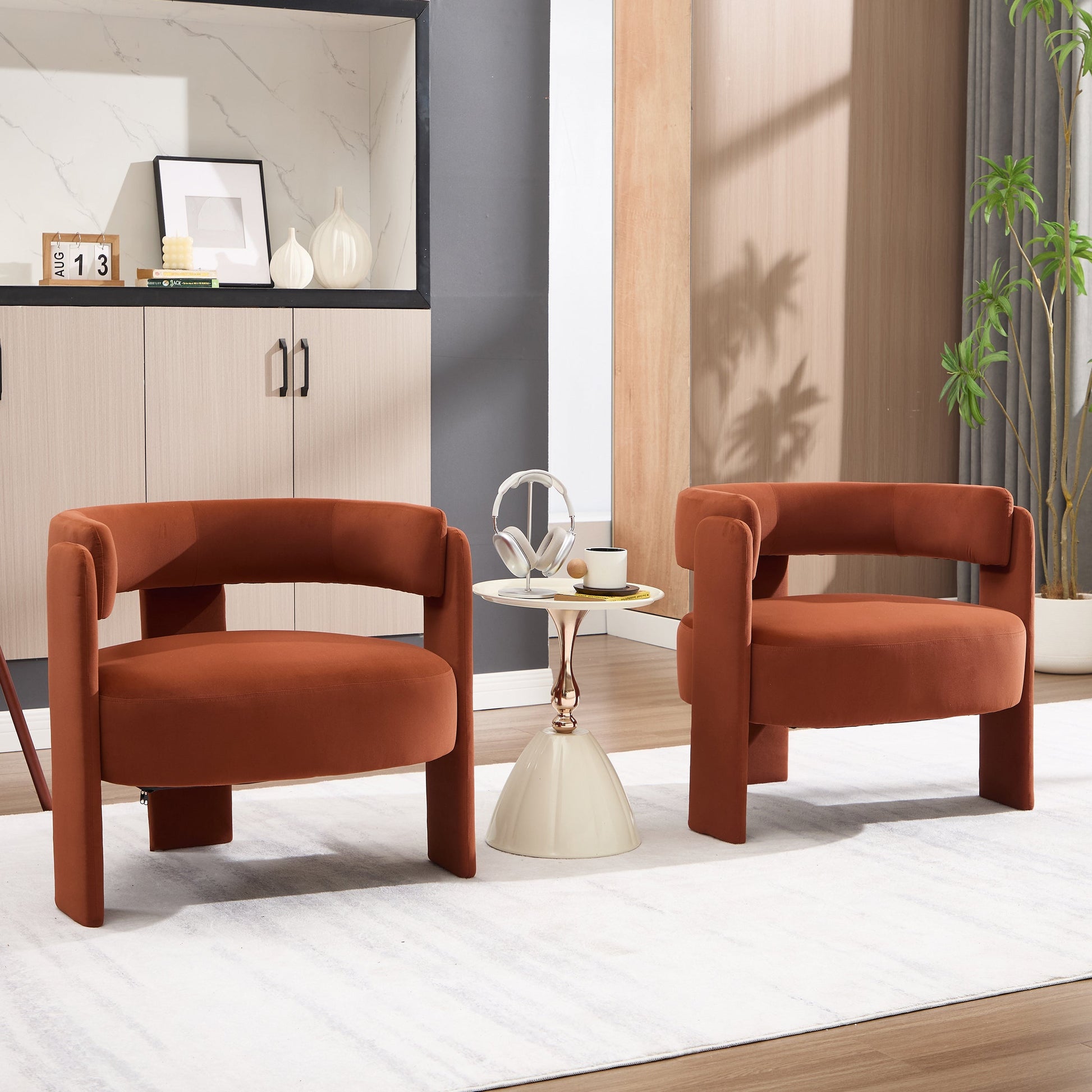Accent chairs: three orange velvet chairs around a small round table in a living room on Tampa Home & Garden Store