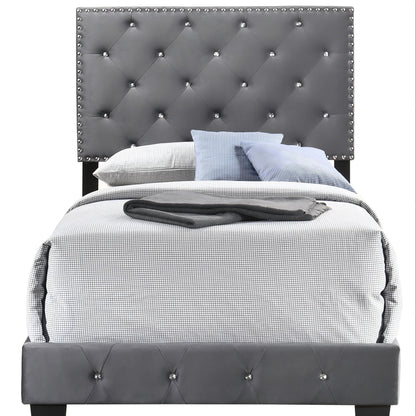 HouseOfZazla upholstered bed with tufted grey headboard and stud trim; grid bedding on Tampa Home & Garden Store