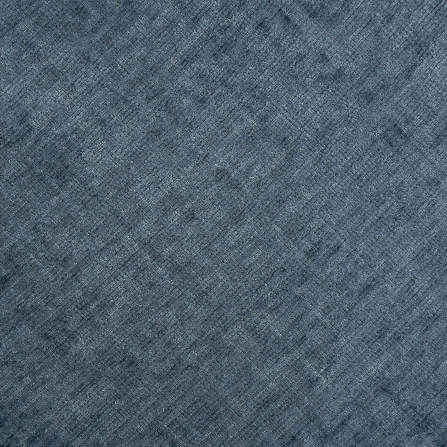 Blue textured carpet close-up with diagonal weave pattern on Tampa Home & Garden Store