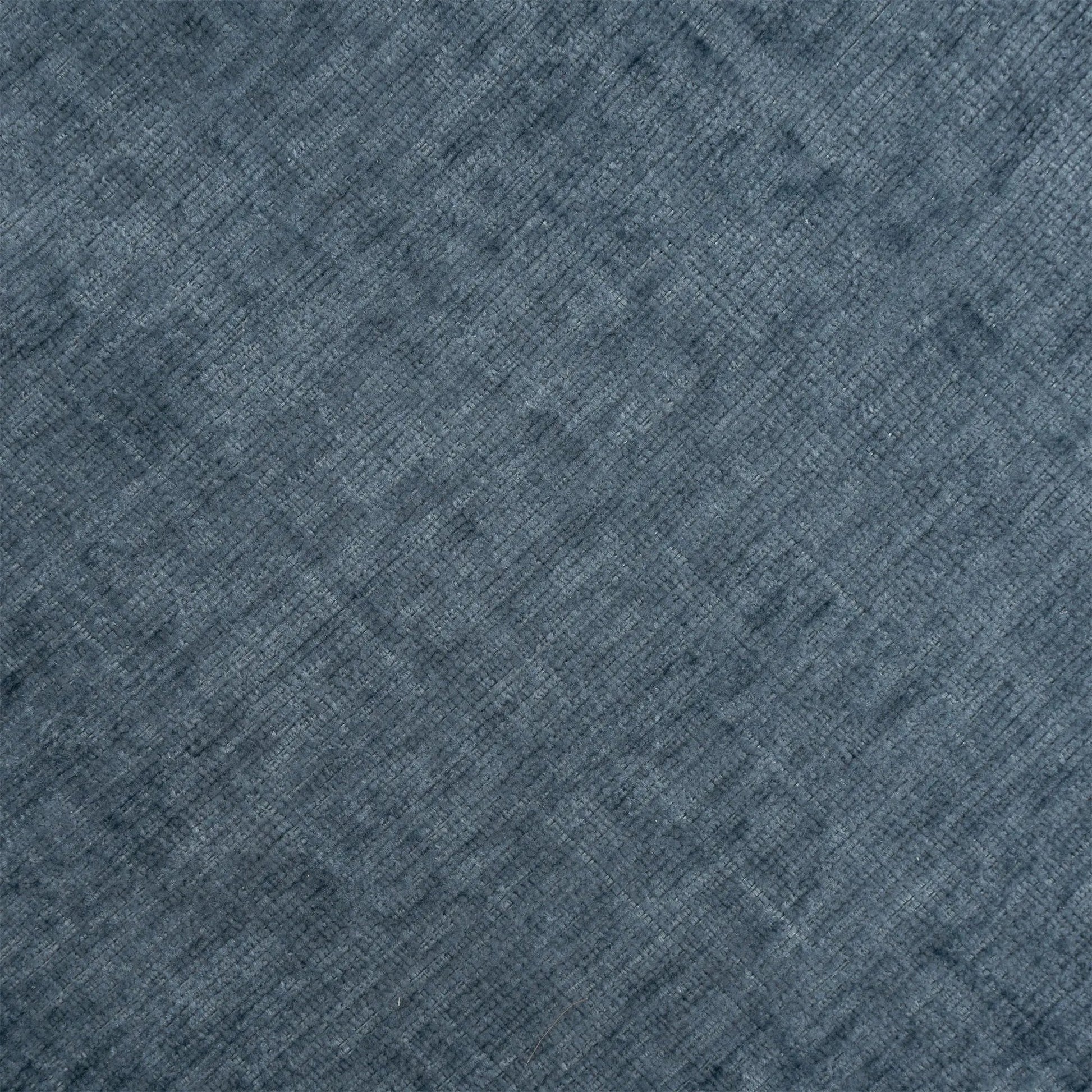 Blue textured carpet close-up with diagonal weave pattern on Tampa Home & Garden Store