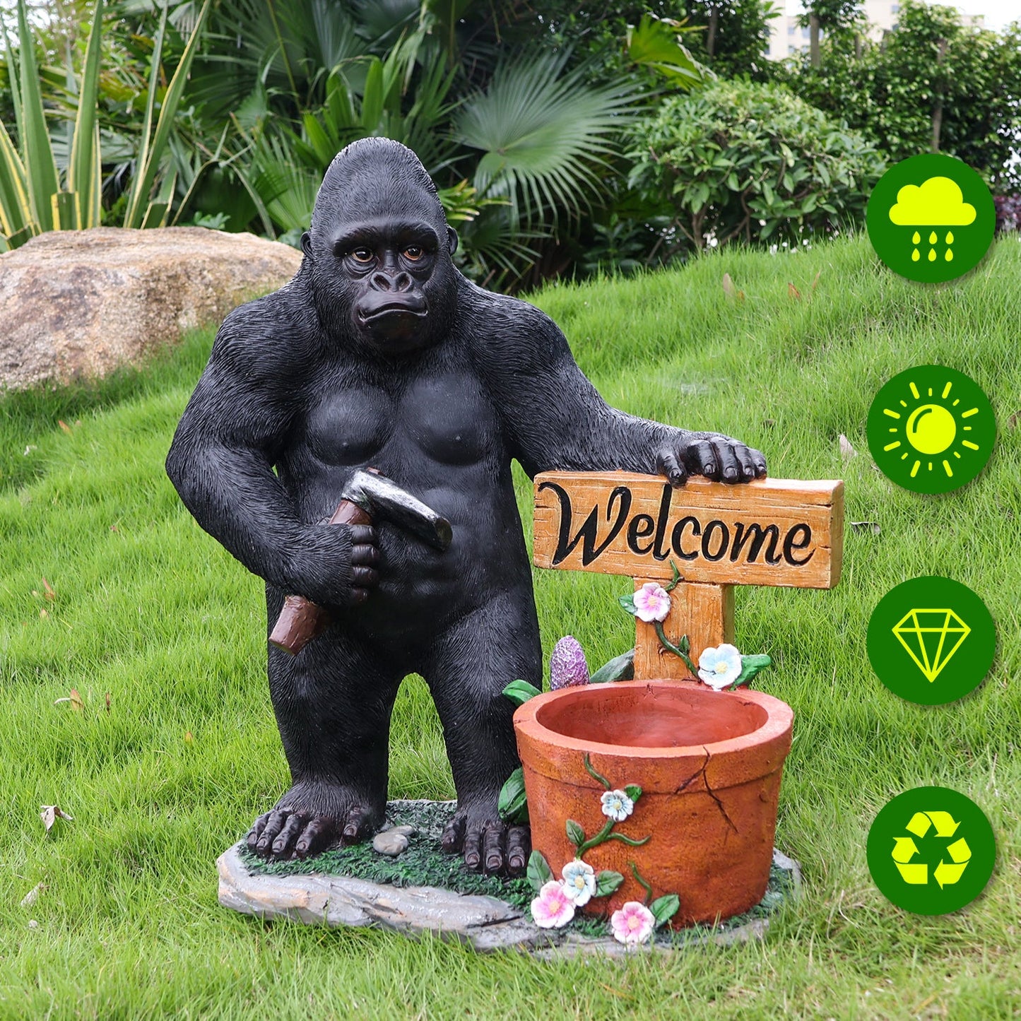 Outdoor chimpanzee garden statue with hammer beside welcome sign flower-pot planter on Tampa Home & Garden Store