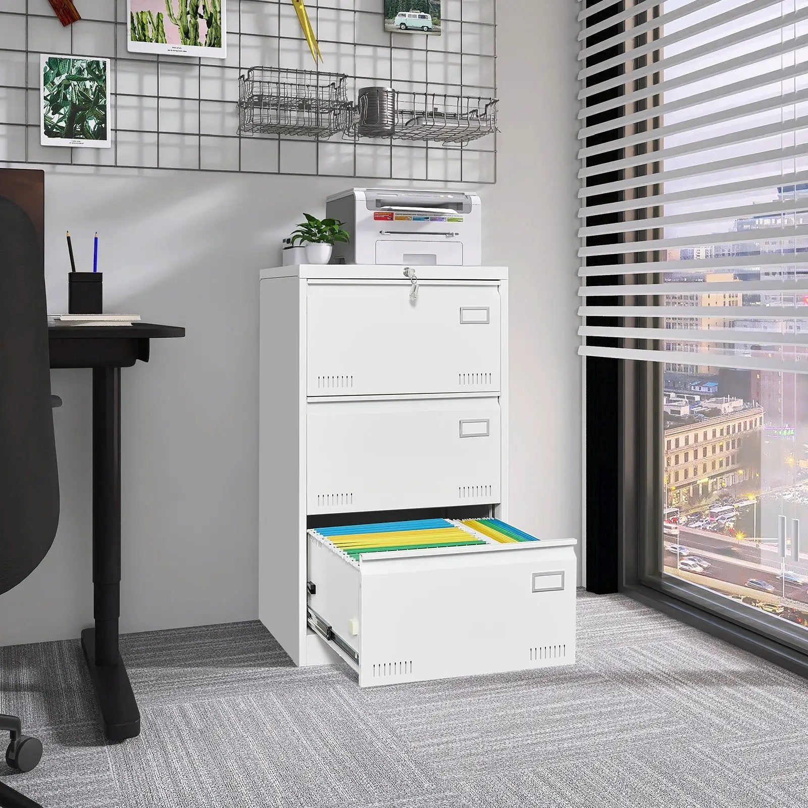 Three-drawer locking metal filing cabinet, white finish with bottom drawer open showing color folders on Tampa Home & Garden Store