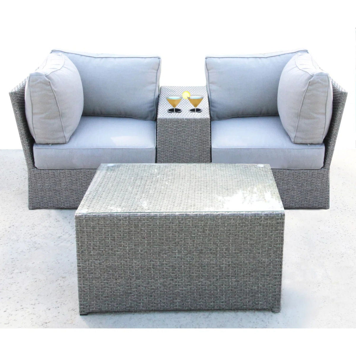 Two-piece outdoor rattan sectional with light gray cushions and wicker coffee table on Tampa Home & Garden Store