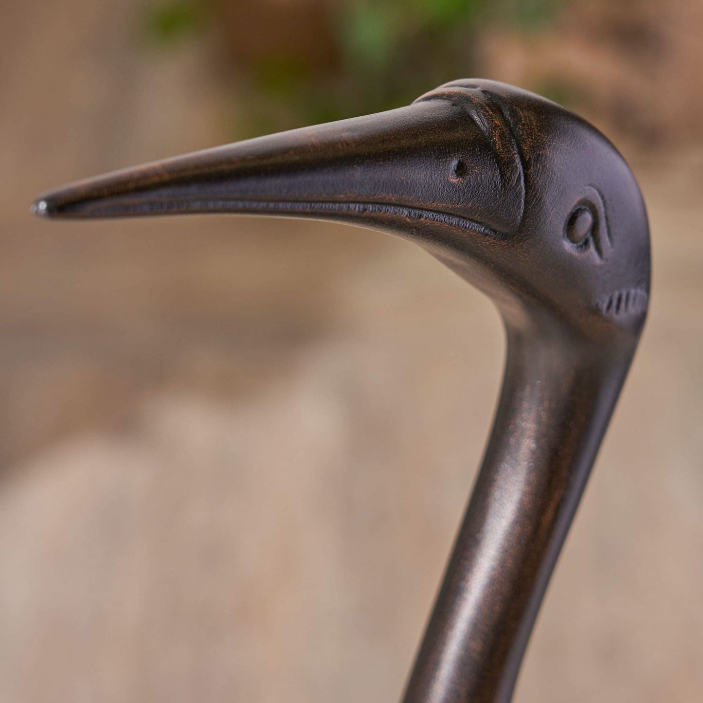Bird Animals - Cranes for Outdoor Decor dark brown metal crane beak close-up texture on Tampa Home & Garden Store