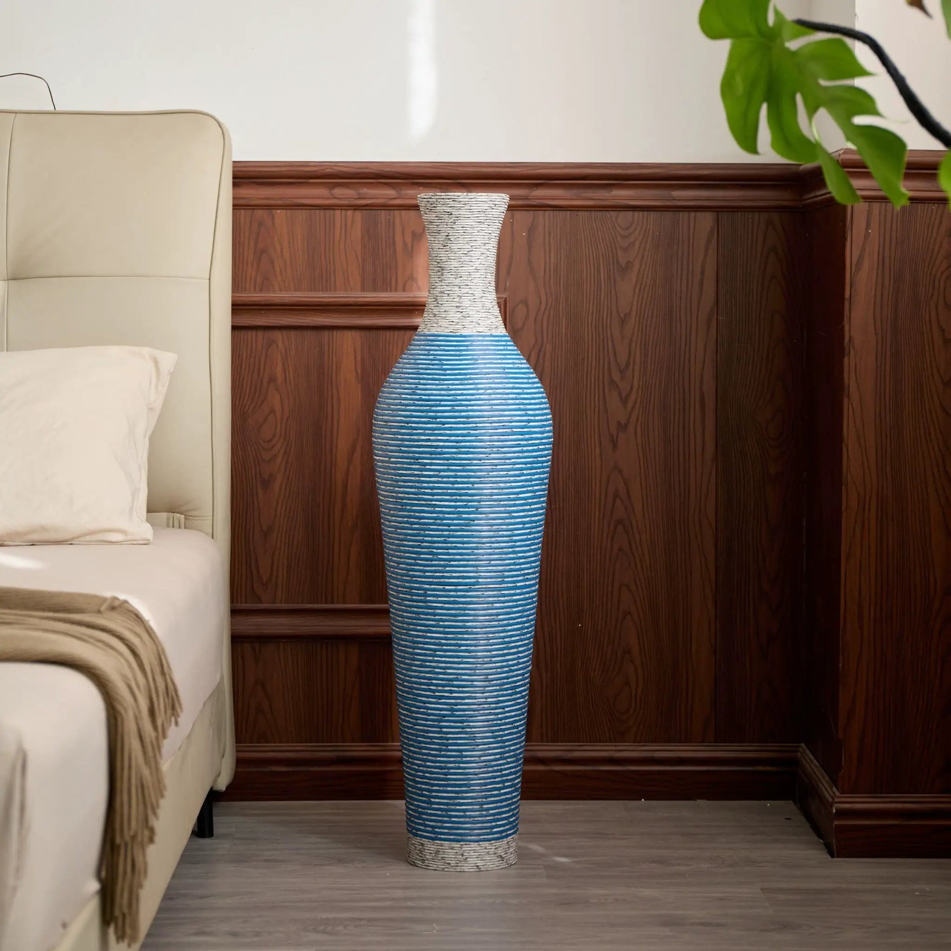 Floor vase set of 3, tall blue and white striped ceramic with textured white neck, placed beside a beige bed in a bedroom on Tampa Home & Garden Store