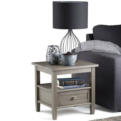 Warm Shaker handcrafted coffee table in gray wood with drawer and lower shelf, shown with lamp on Tampa Home & Garden Store