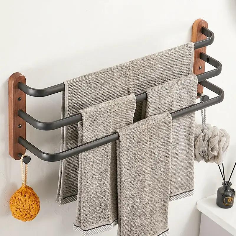 Solid wood towel rack wall hanging multi-bar with dark metal arms and wood mounts on Tampa Home & Garden Store