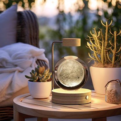 Crystal Ball Cosmic Dinosaur night light with glass ball and wooden base on Tampa Home & Garden Store