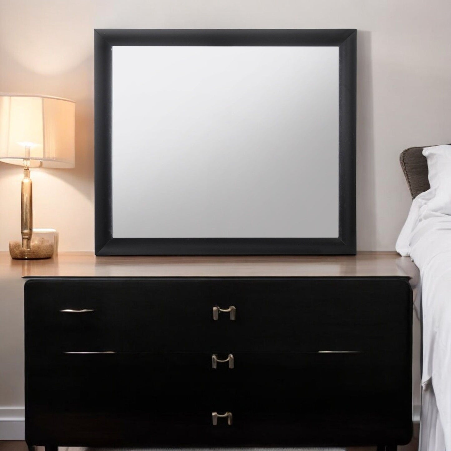 Ireland Contemporary Design Mirror with black frame on a black dresser in a bedroom on Tampa Home & Garden Store
