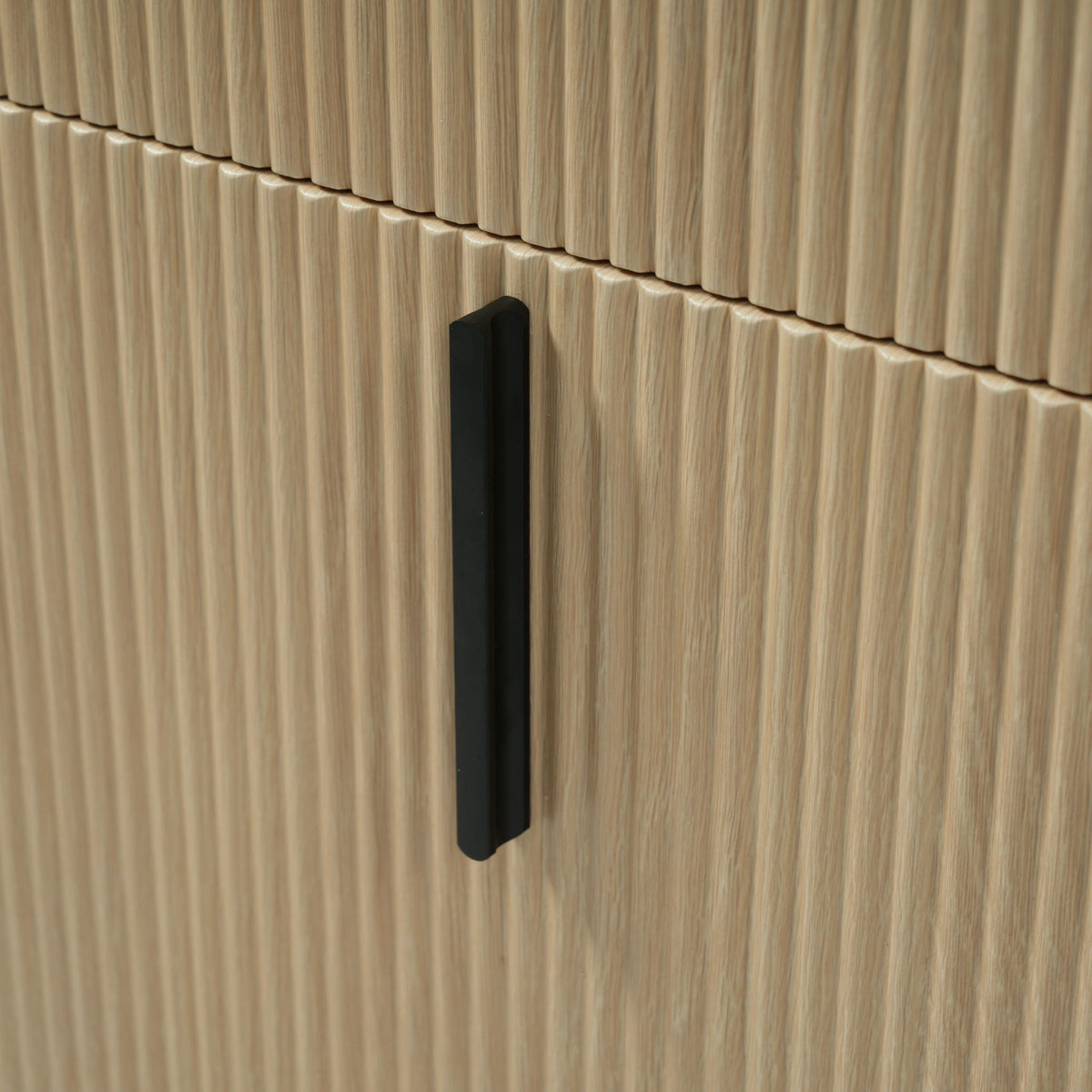 Bathroom vanity panel with fluted light brown wood, black vertical handle, close-up view on Tampa Home & Garden Store