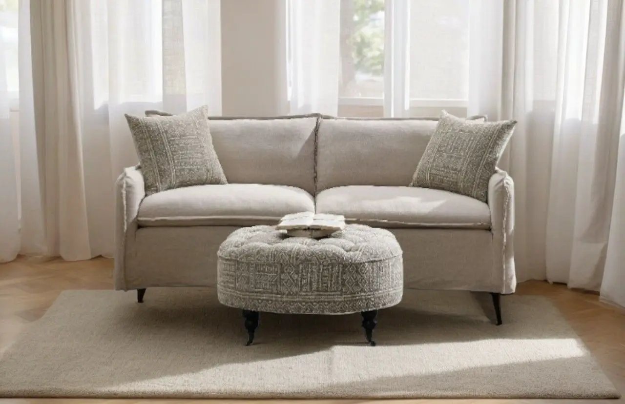 Upendo pattern linen sofa with 2 beige toss pillows in a bright living room by Unique Piece Furniture on Tampa Home & Garden Store