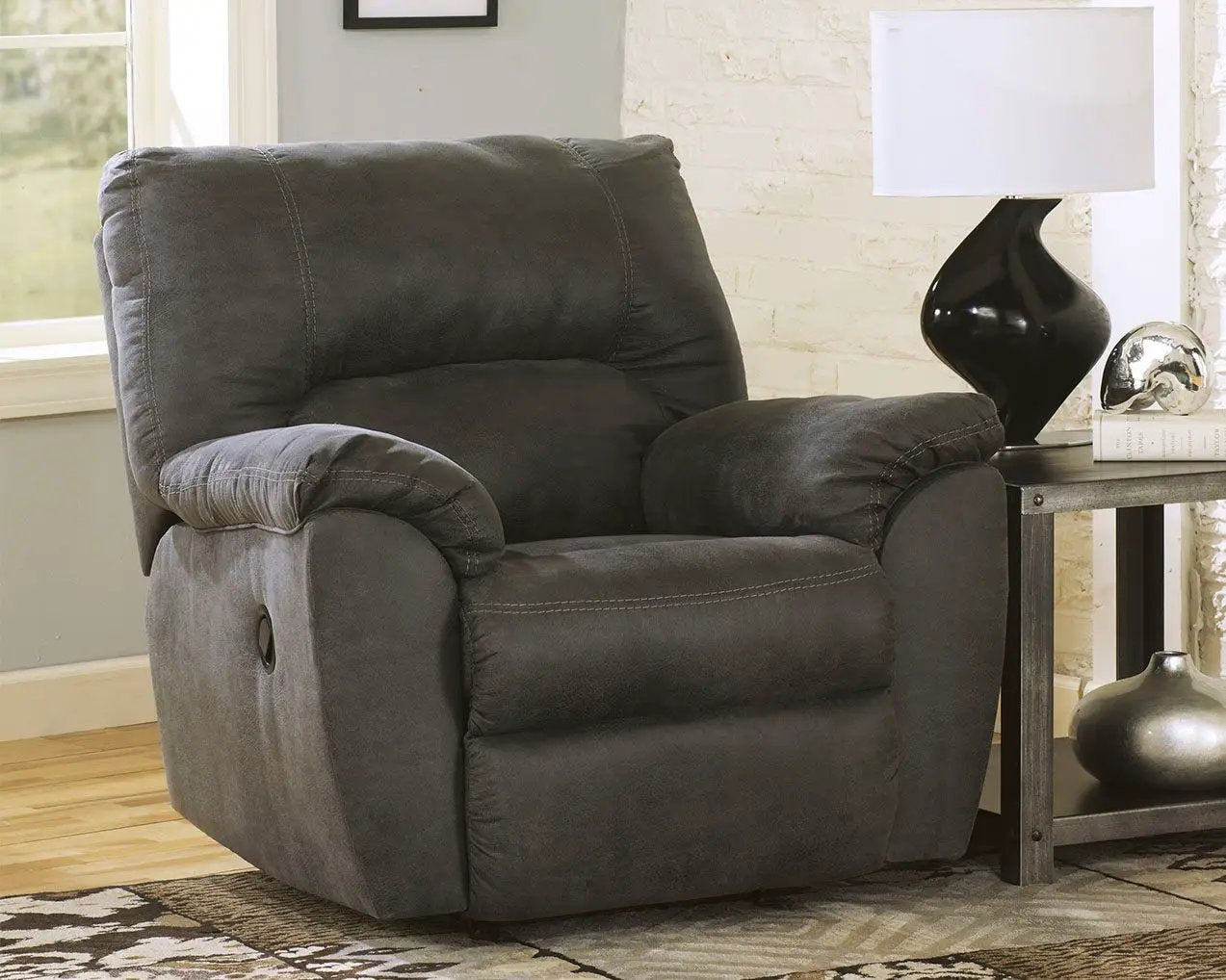 Tambo rocker recliner in dark gray fabric with plush cushions on Tampa Home & Garden Store