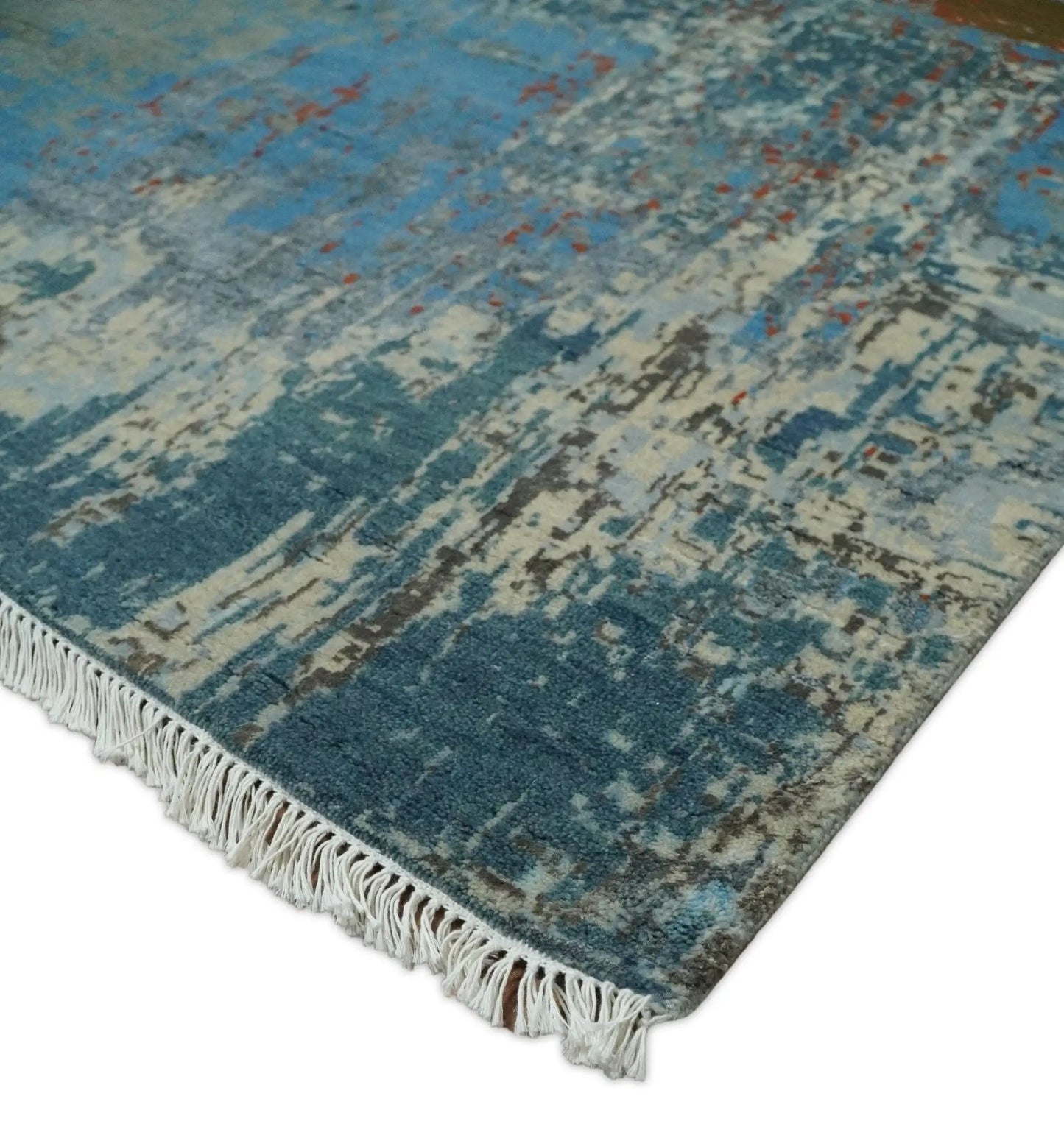 Beige and blue hand knotted wool and silk area rug with fringed edges by The Rug Decor on Tampa Home & Garden Store