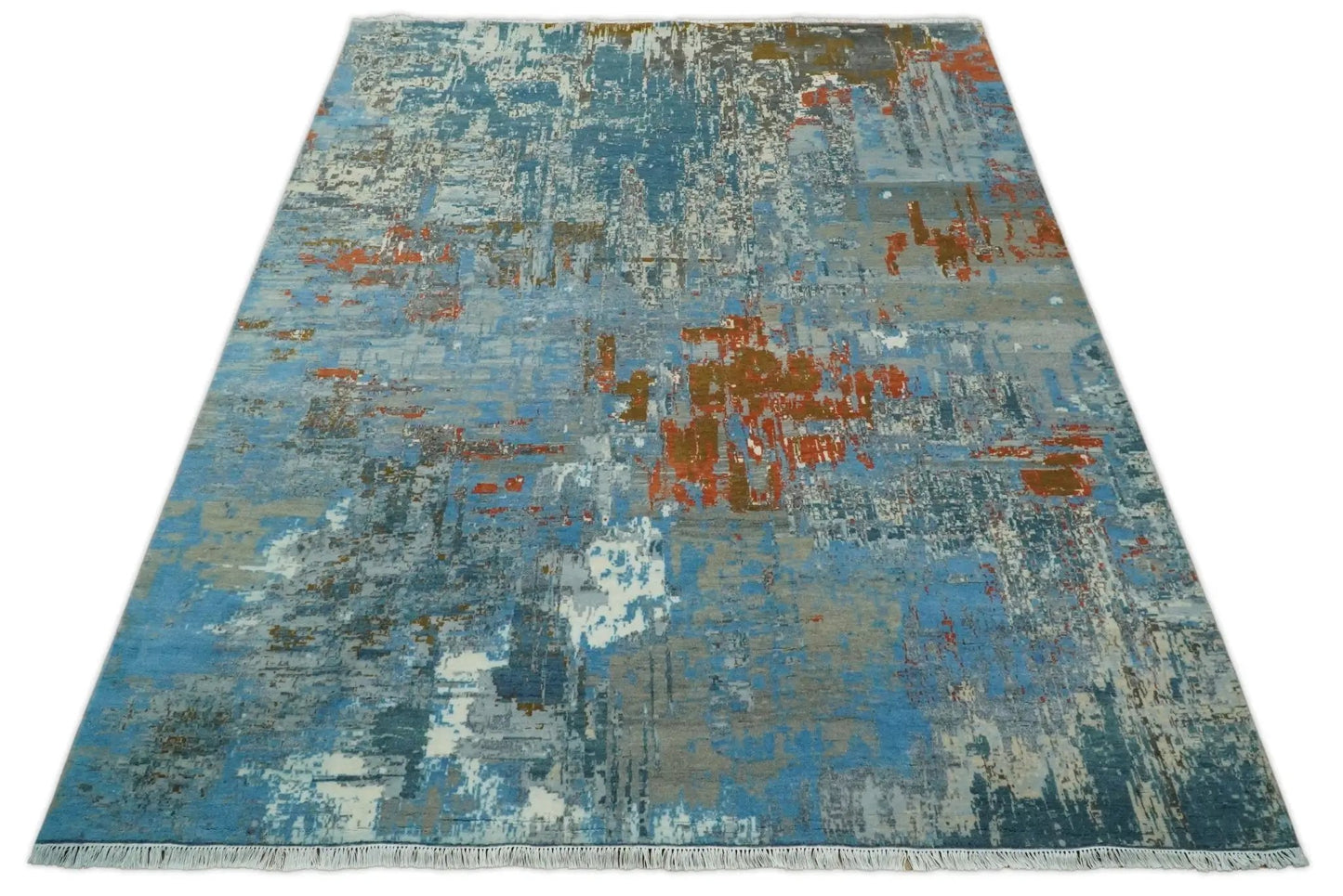 Beige and blue hand-knotted wool and silk area rug with abstract pattern and fringed ends 8x10 on Tampa Home & Garden Store
