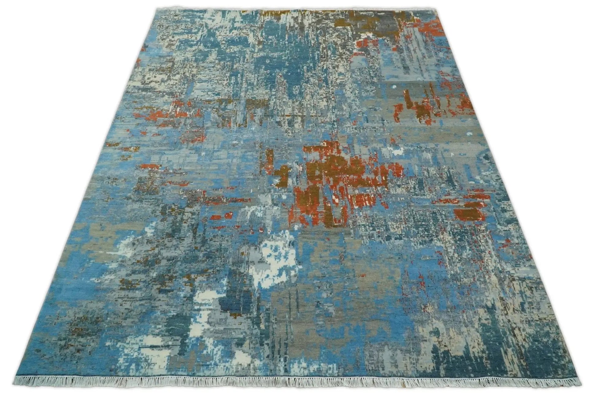 Beige and blue hand-knotted wool and silk area rug with abstract pattern and fringed ends 8x10 on Tampa Home & Garden Store