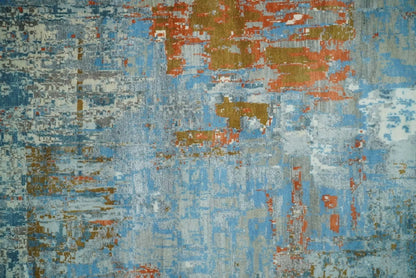 Beige and blue hand knotted wool and silk area rug with abstract pattern on Tampa Home & Garden Store