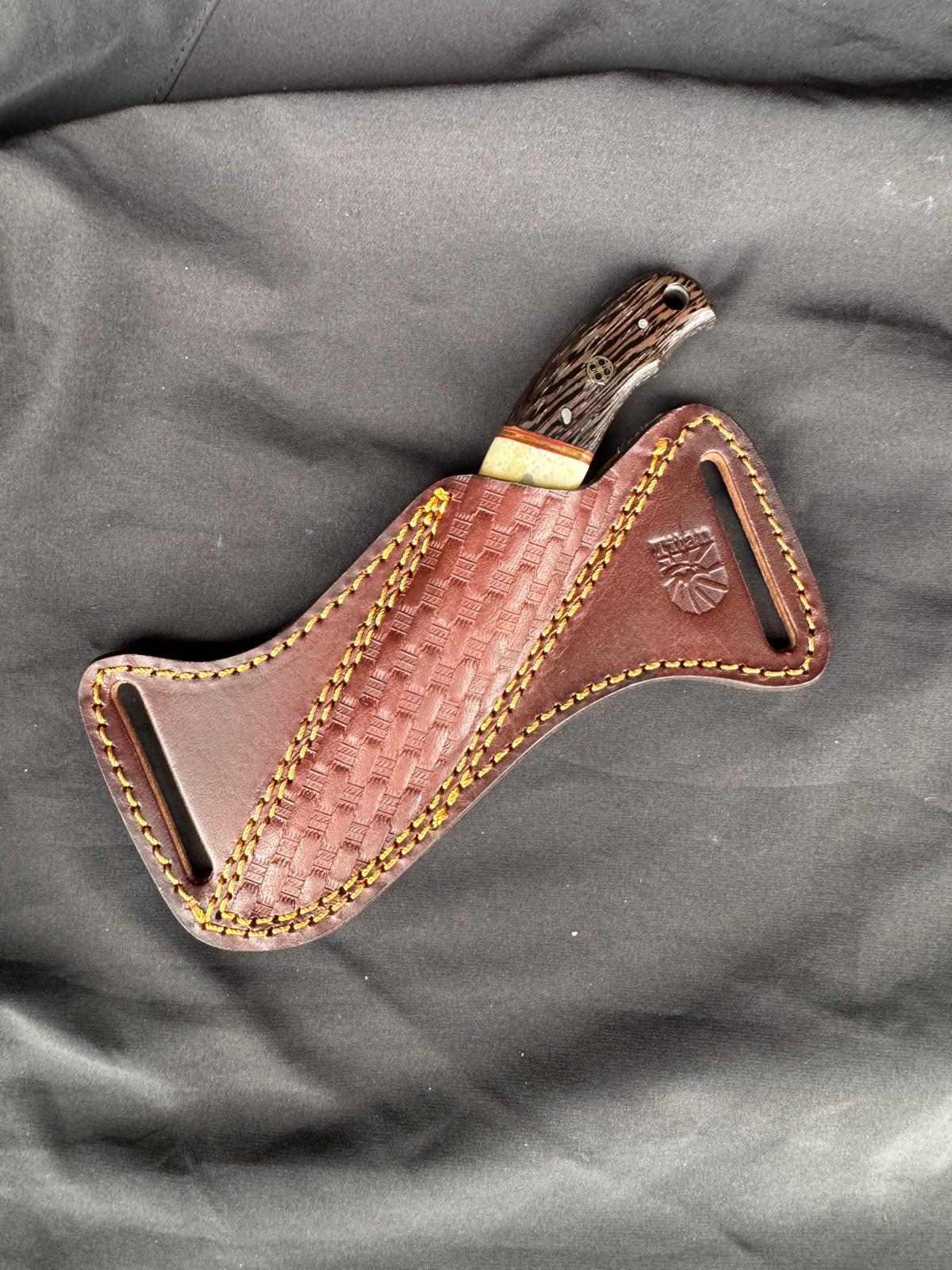 Titan Skinner fixed blade with striped wood handle and high carbon steel blade in sheath on Tampa Home & Garden Store