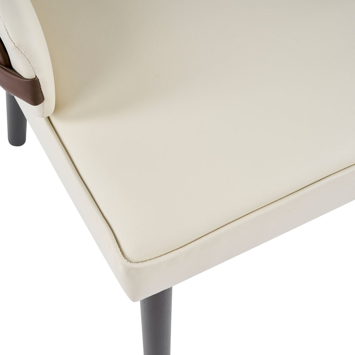 Indoor dining chair beige upholstery with brown armrest and gray leg close-up on Tampa Home & Garden Store