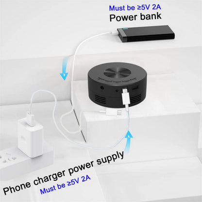 Smart portable projector 1080P LED, black round unit with top dial wired to a power bank on Tampa Home & Garden Store