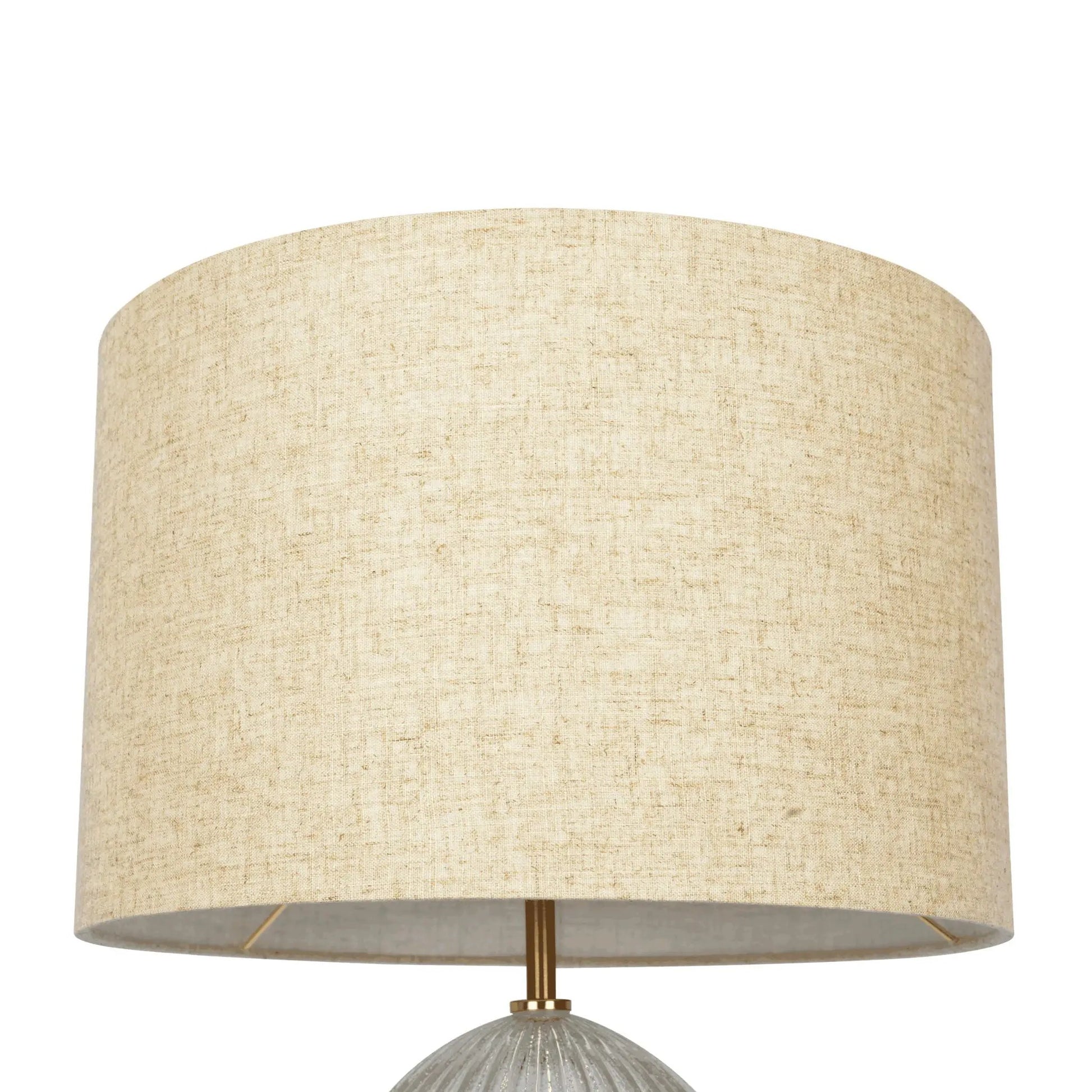 Table lamp with large beige linen shade and ribbed clear base with gold hardware on Tampa Home & Garden Store