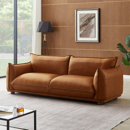 Mid-Century modern leather sofa in tan brown with clean lines on Tampa Home & Garden Store