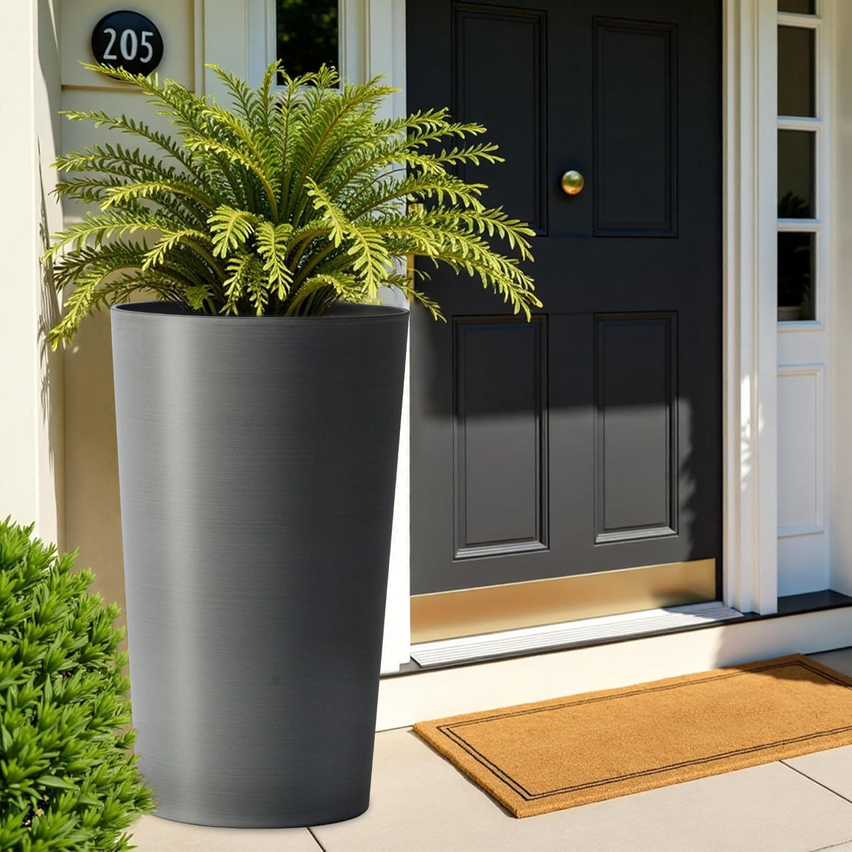Planter For Outdoor large dark gray planter with lush fern by a black front door on Tampa Home & Garden Store