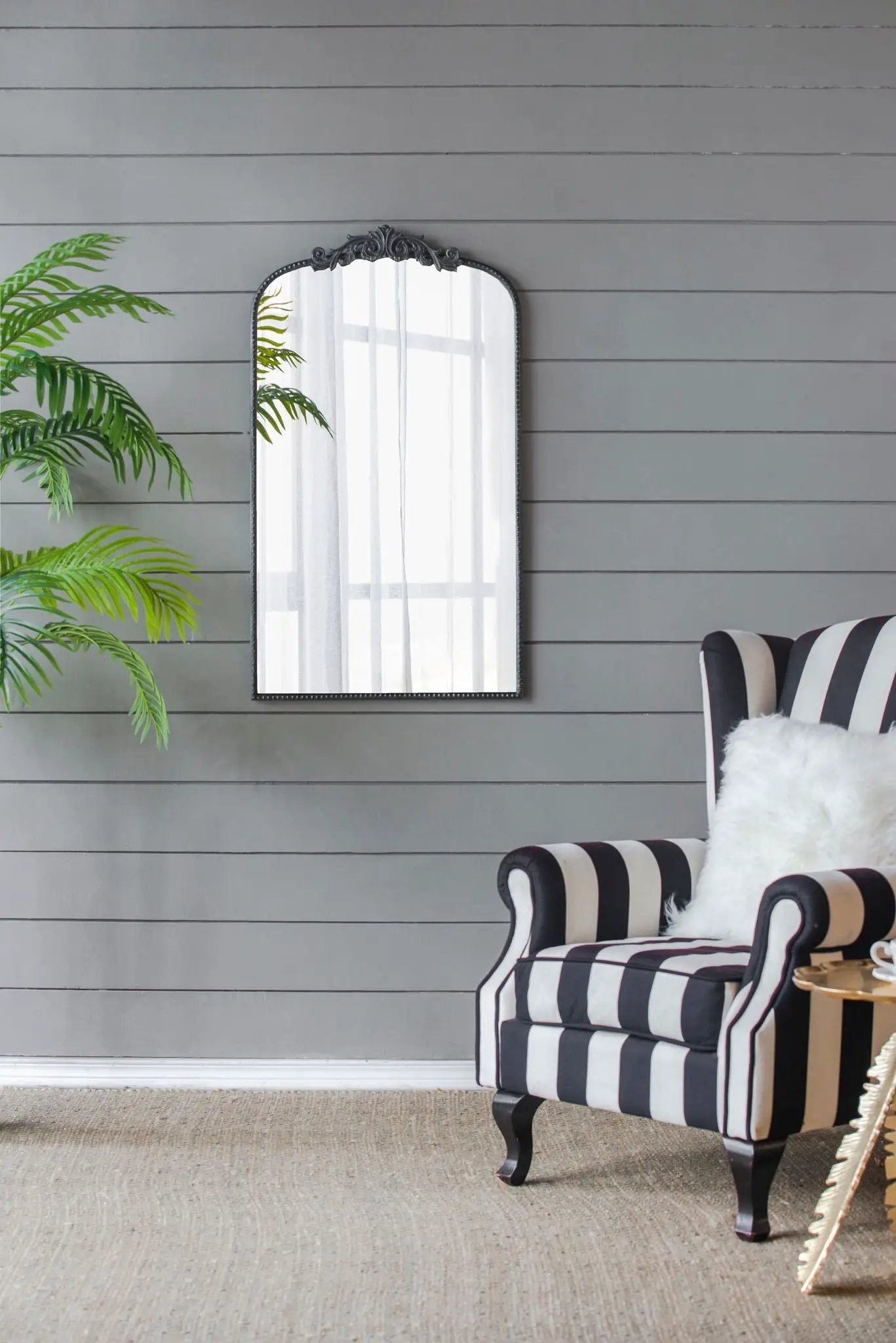 Arch mirror by Unique Piece Furniture ornate black frame with baroque crest on gray shiplap on Tampa Home & Garden Store