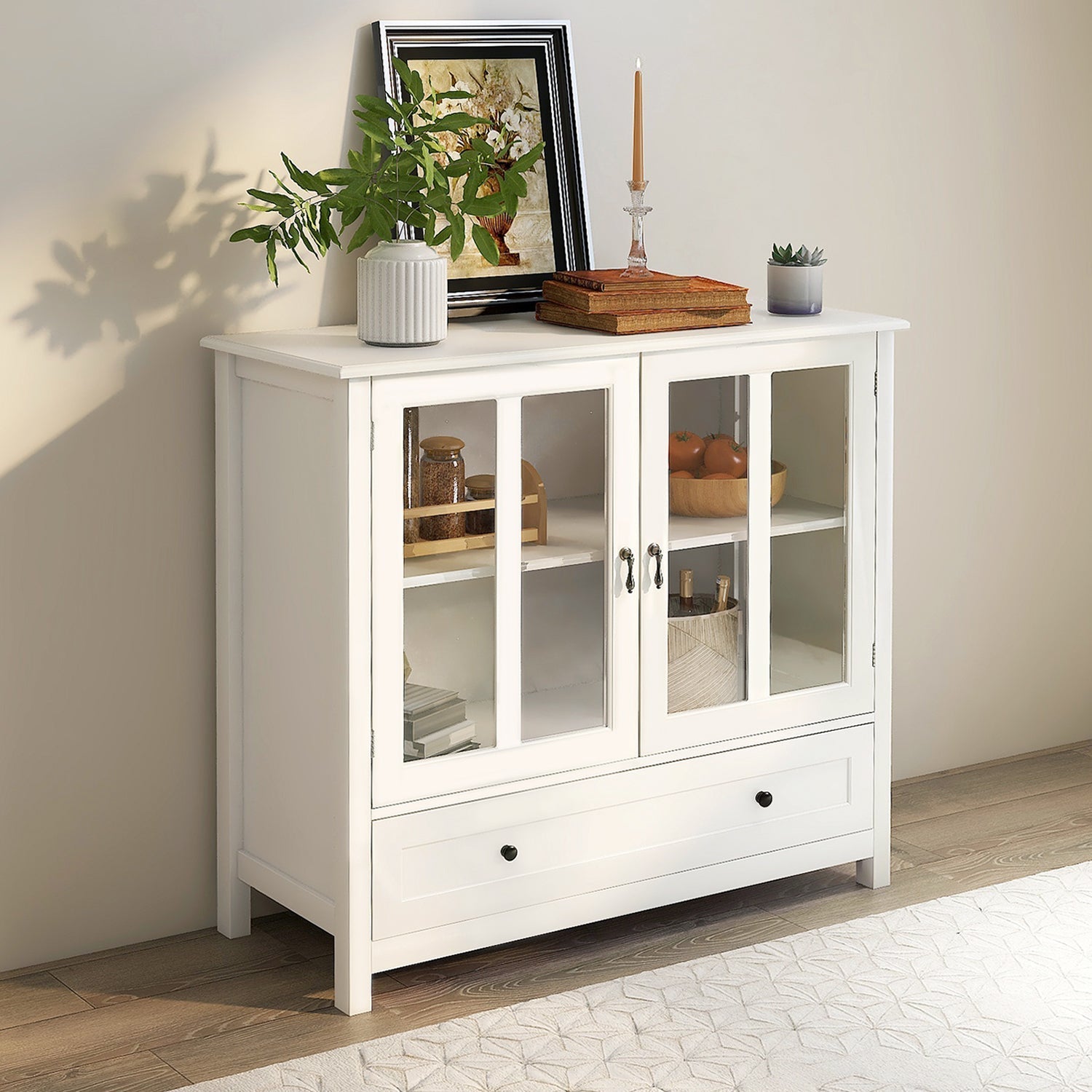 Buffet storage cabinet in white with double glass doors and bell handles on Tampa Home & Garden Store