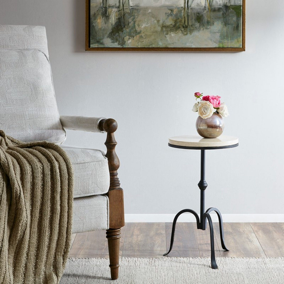 Black Gaberial accent table with sturdy metal frame and light wood top beside beige chair on Tampa Home & Garden Store