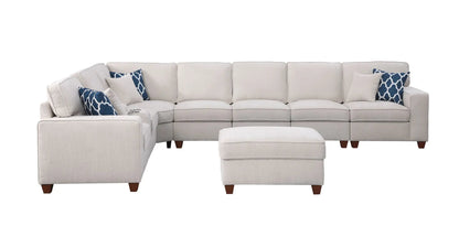 Ted beige sectional sofa with ottoman 2-piece set by Unique Piece Furniture with blue pillows on Tampa Home & Garden Store