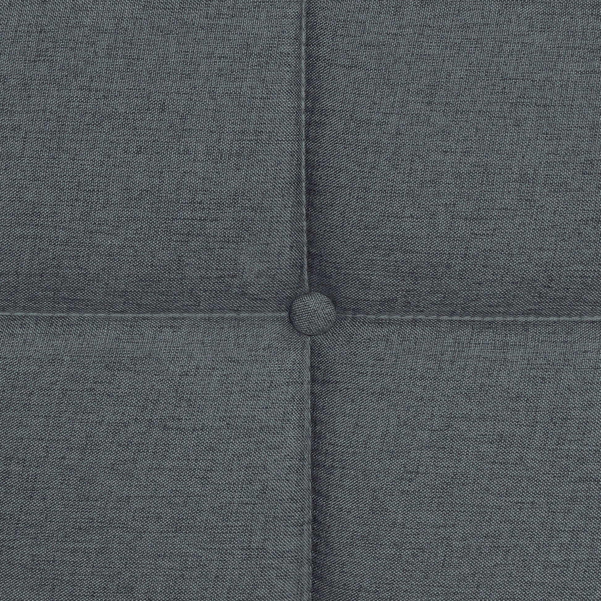 Queen size dark gray linen upholstered bed headboard with button tuft close-up on Tampa Home & Garden Store