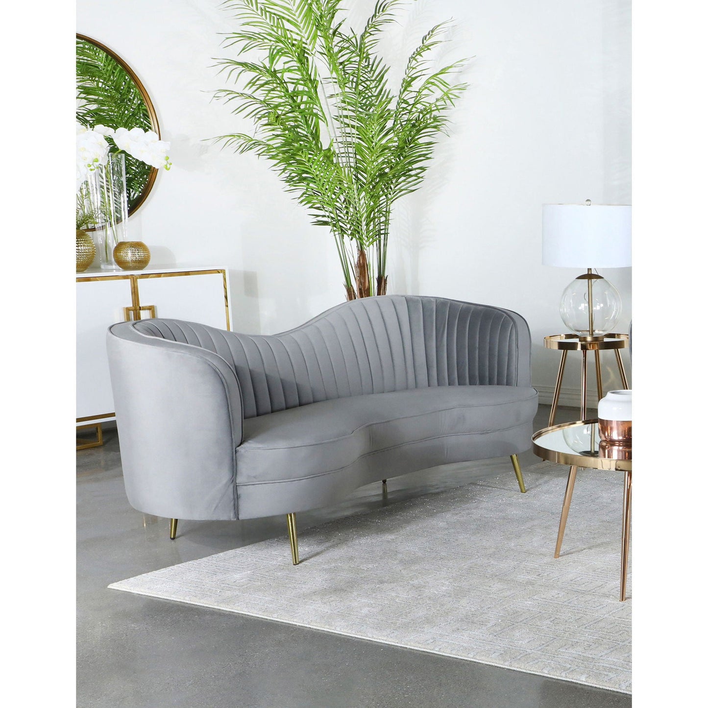 Reigha gray upholstered sofa lounge with channel tufted backrest and gold legs on Tampa Home & Garden Store