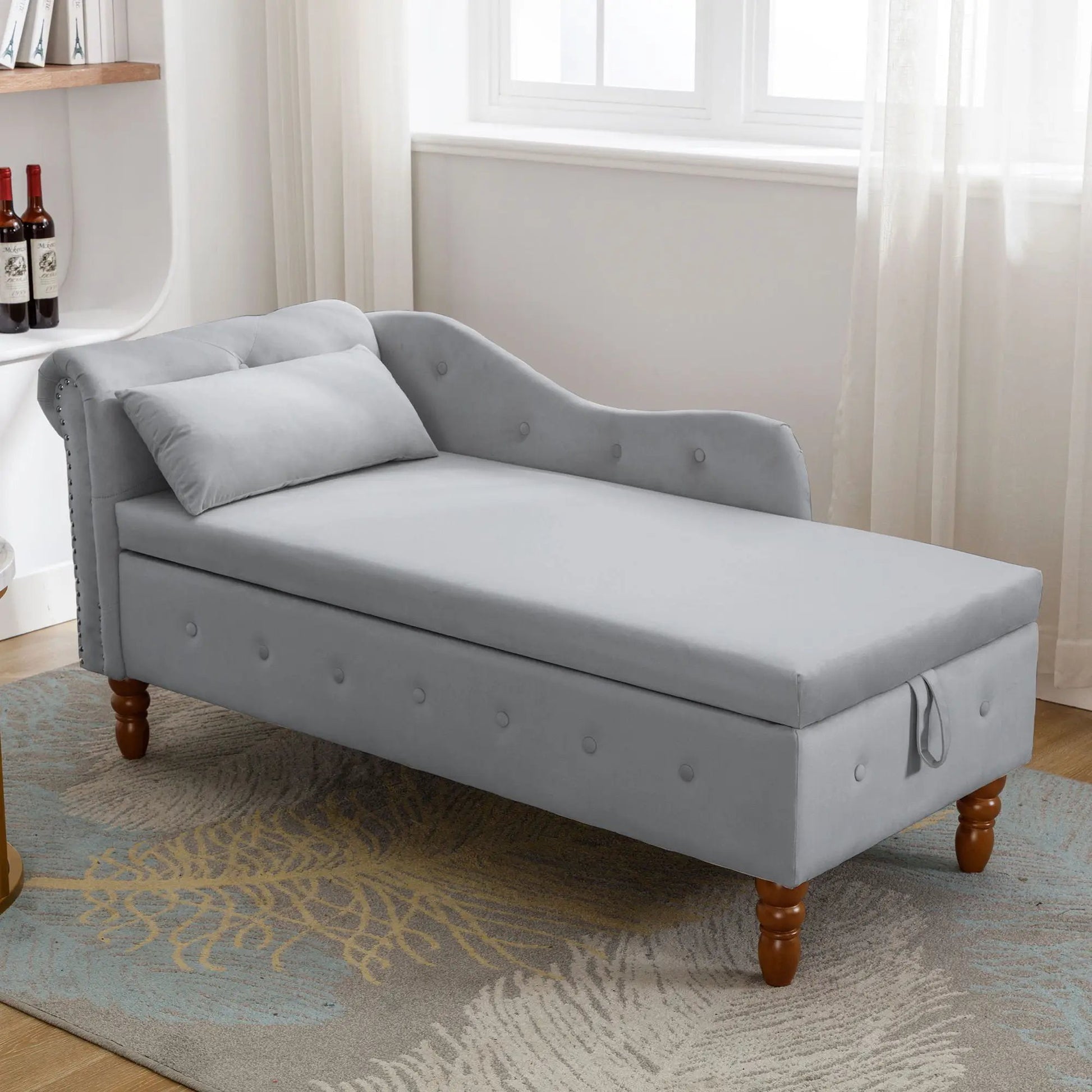 Gray upholstered chaise lounge with rolled arm, nailhead trim, and storage, includes pillow on Tampa Home & Garden Store
