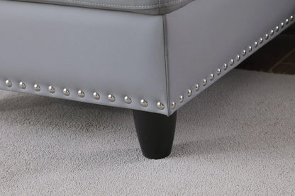 Irine gray sectional sofa with ottoman, 2-piece set, faux leather with nailhead trim on Tampa Home & Garden Store