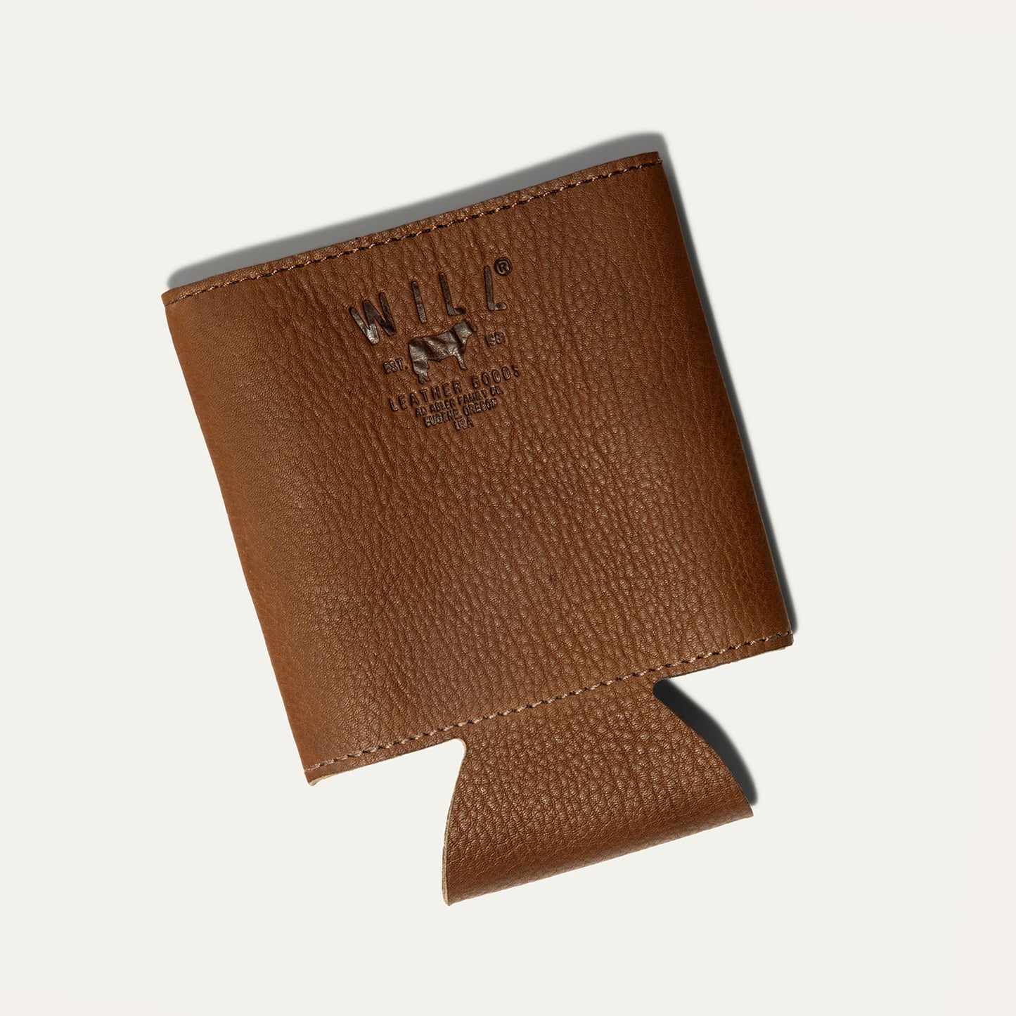 Leather bottle and can holder in brown pebbled leather featuring Will Leather Goods branding on Tampa Home & Garden Store